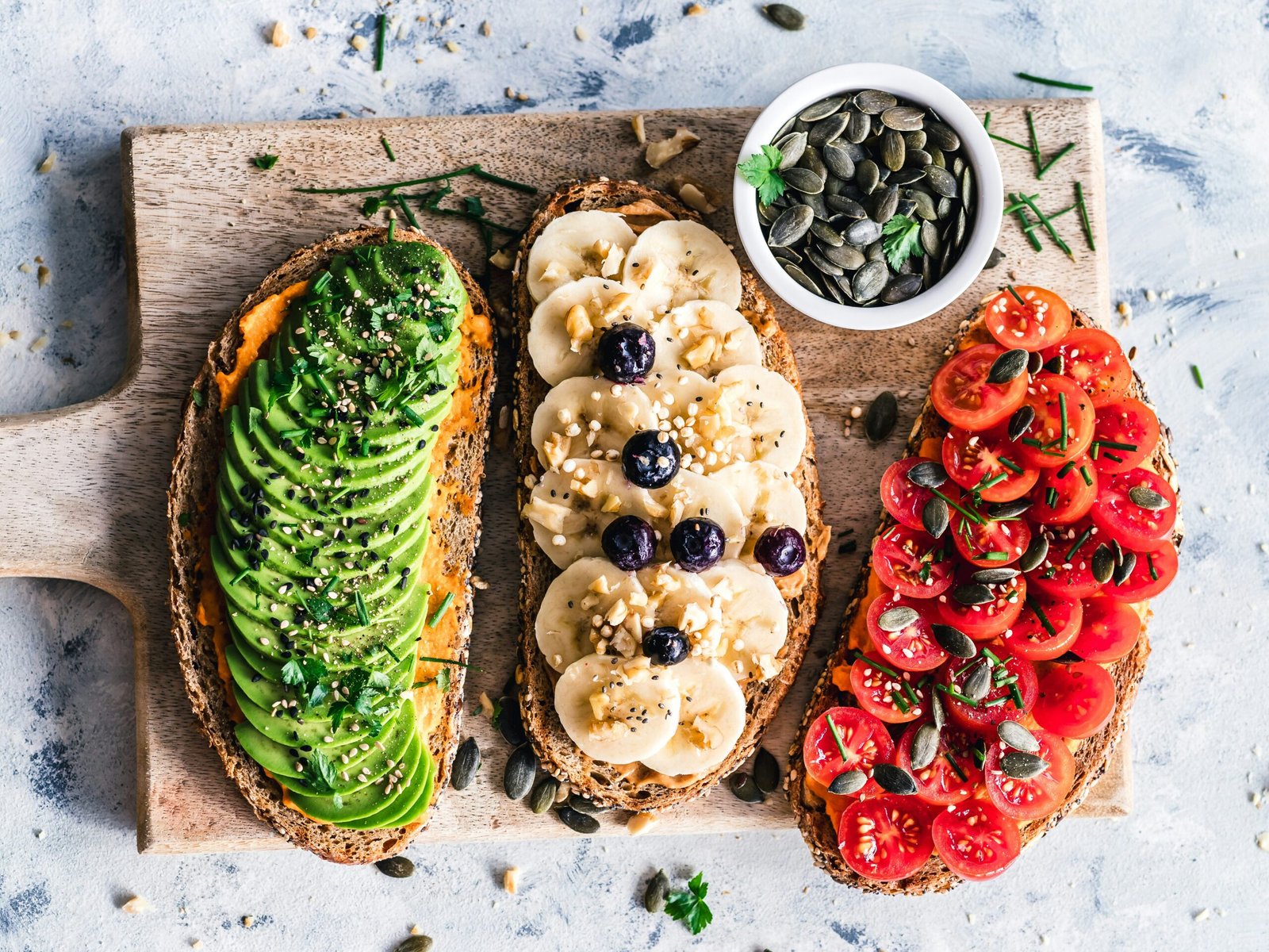 assorted fruits and vegetable on brown wooden chopping board